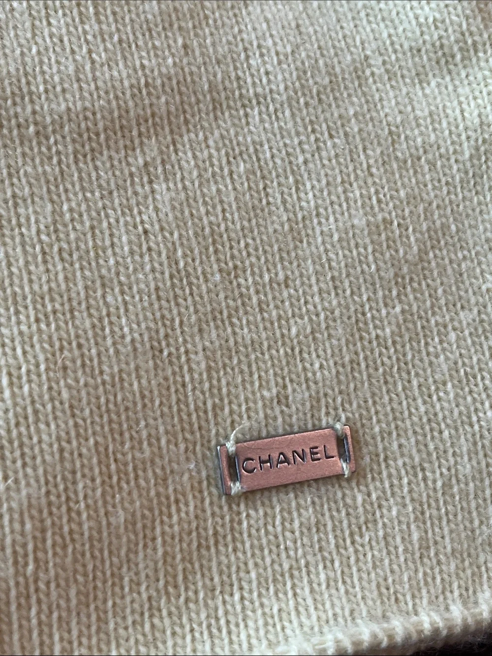 CHANEL Cream Knit Top with Metal Logo Plaque